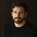 Client headshot: a man in his thirties, founder