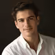 Client headshot: a young man with short hair