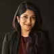 Client headshot: a woman in her thirties